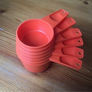 Tipperware vintage antique measuring cups in orange